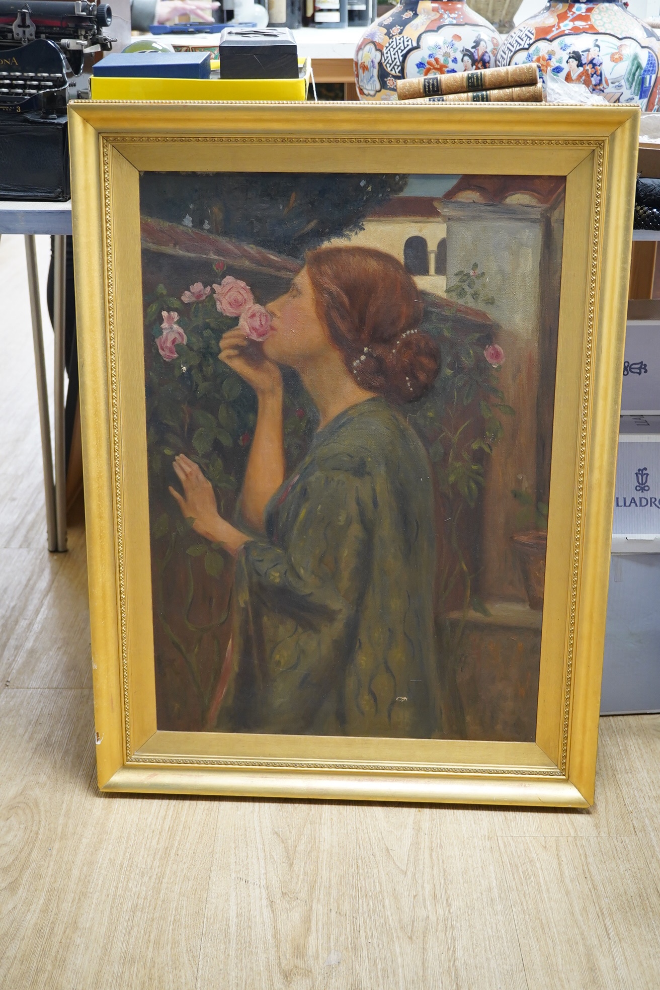 Oil on canvas, Study of a lady with roses, unsigned, various Lady B M Pink labels verso, 72 x 50cm, gilt framed. Condition - fair